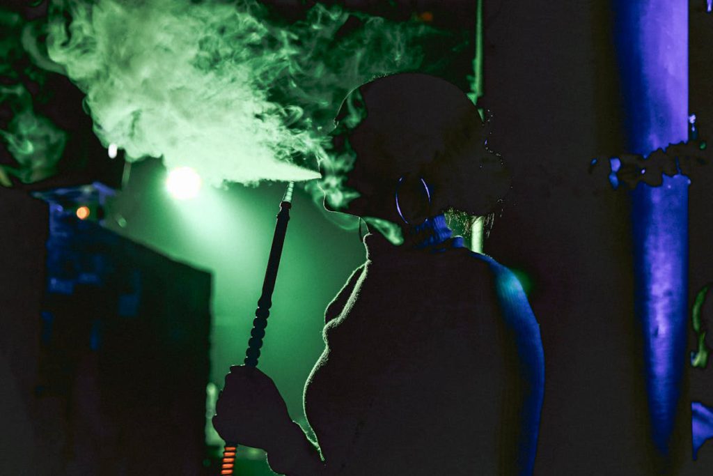 Modern hookah pipe setup with lounge lighting